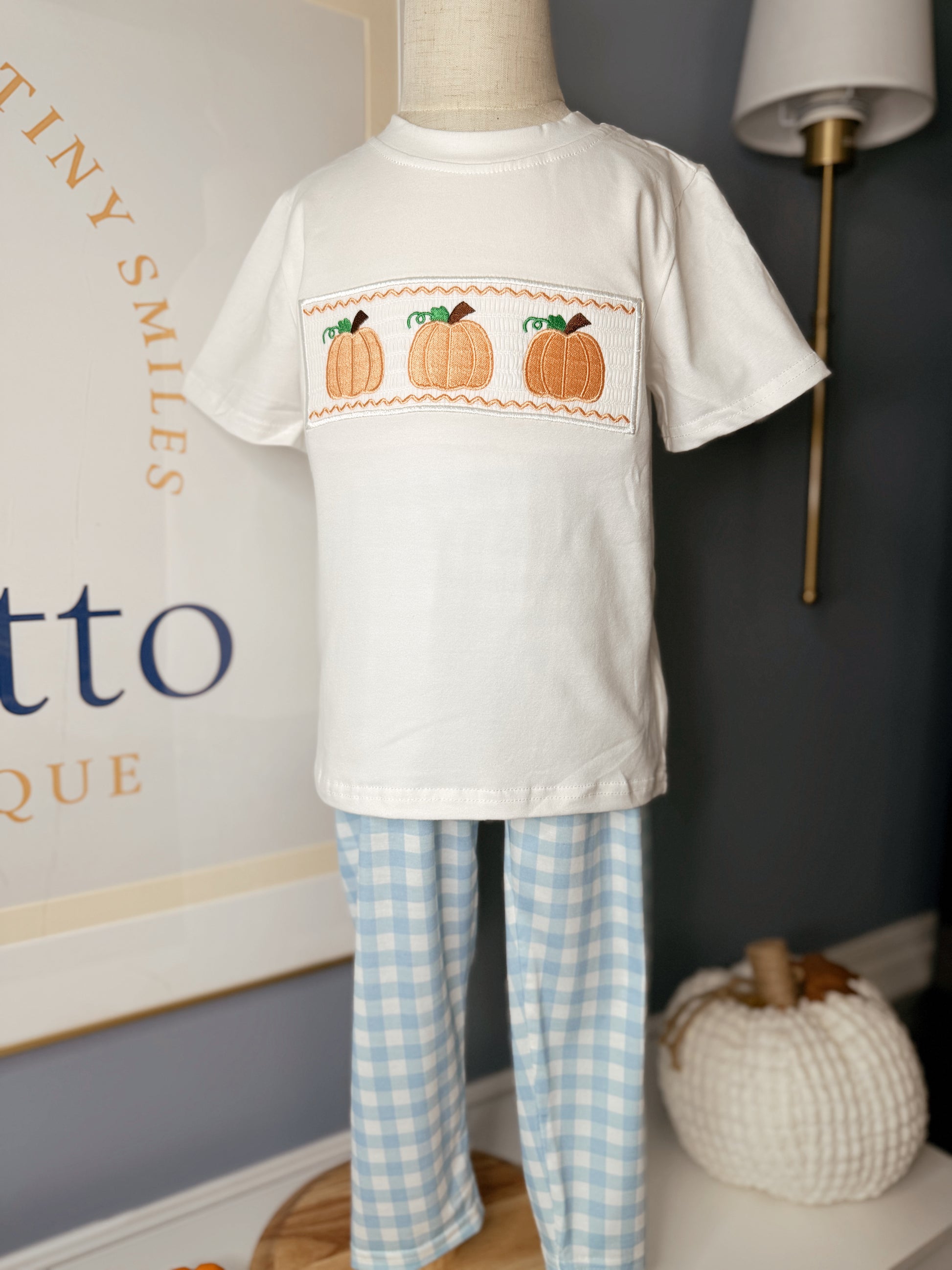 Boys Thanksgiving pumpkin smocking blue plaid set on display