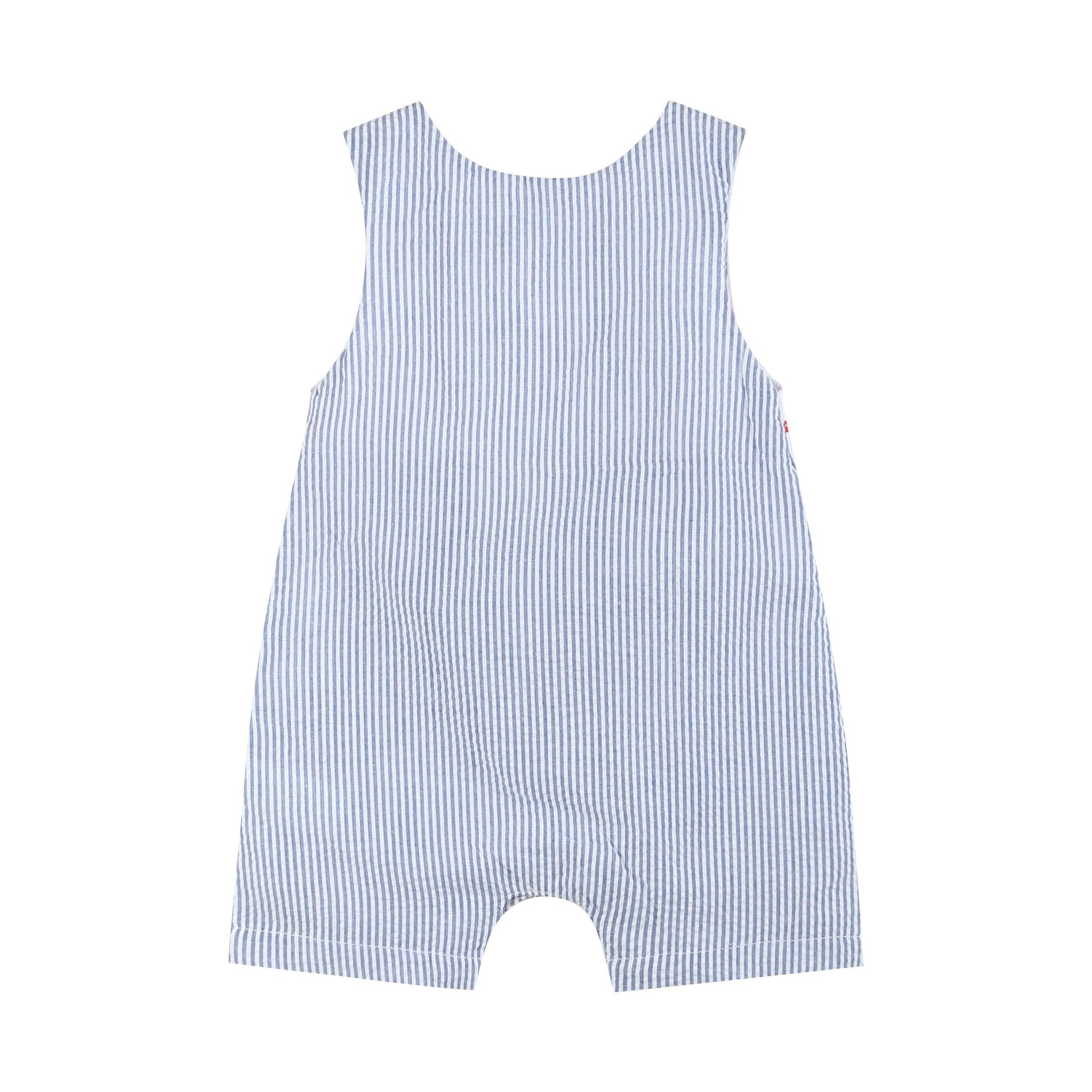 Back view of classic blue seersucker baby boy shortall with snap closures and red shoulder buttons.