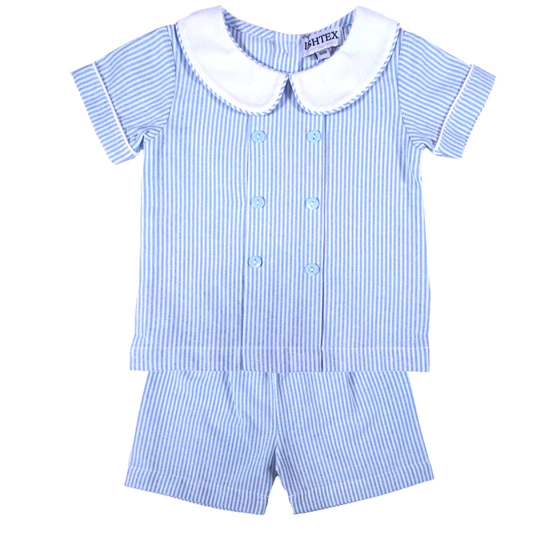 Classic blue and white seersucker boys short set with a white Peter Pan collar, double-breasted buttons, and matching shorts by Palmetto Kids Boutique.