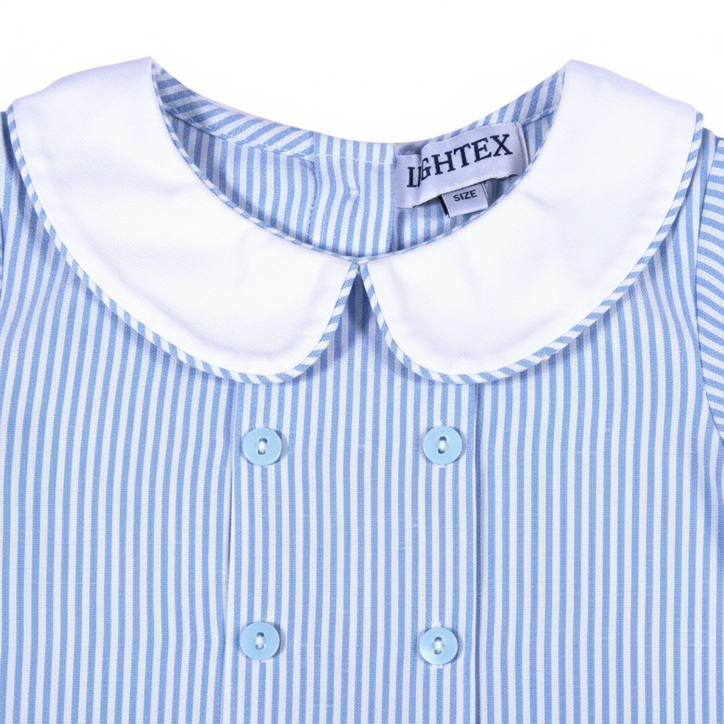 Young boy dressed in a classic Southern blue seersucker Peter Pan short set for weddings, Easter, and special occasions.