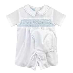 Petit Ami white baby boy bubble featuring blue hand-smocking and a Peter Pan collar by Palmetto Kids Boutique.